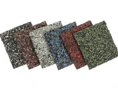 A group of six different colored asphalt shingles.